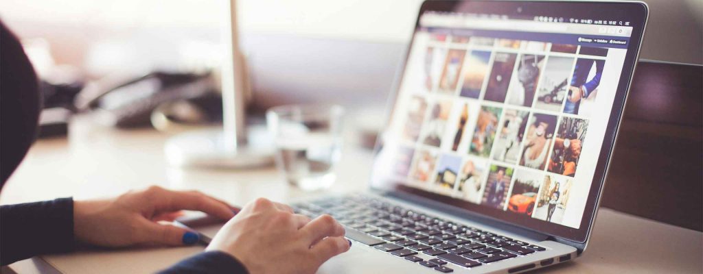 Browsing through and selecting images for your website. Make sure they fit your business and what your audience wants to see.