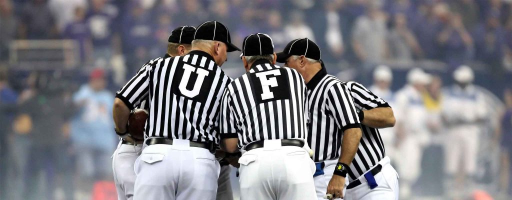 Referees making sure the rules are followed