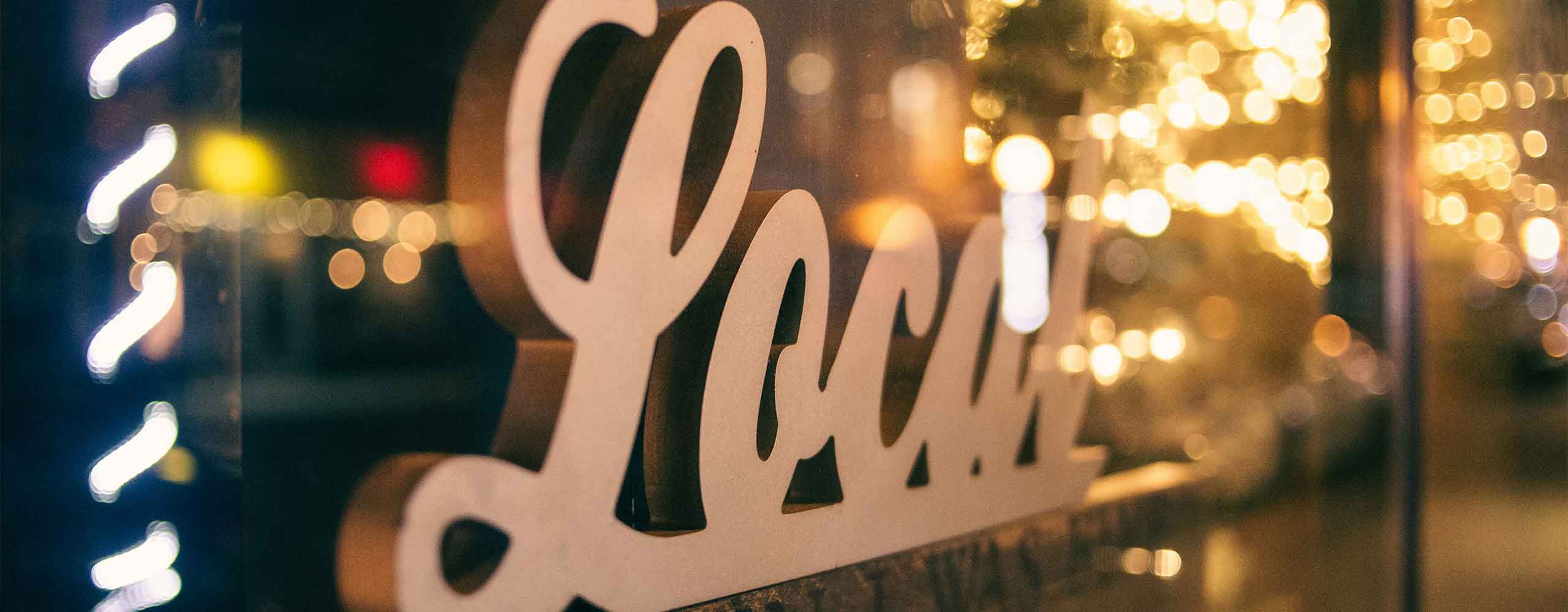 A LOCAL sign in a small business window. An ideal business to use local SEO.