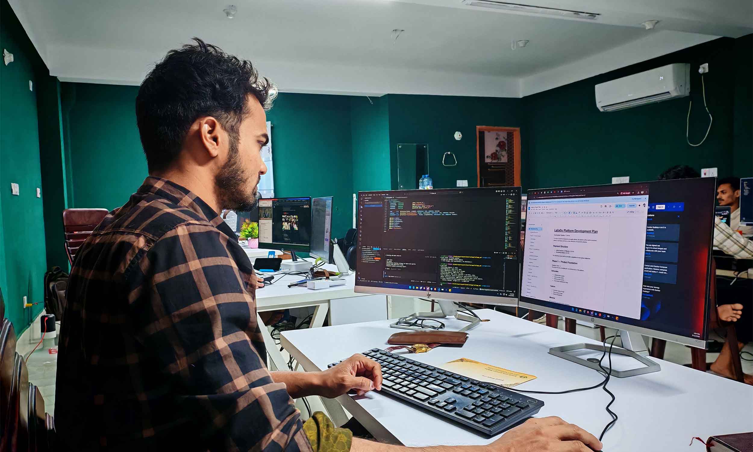 a graphic designer using software to design a restaurant menu